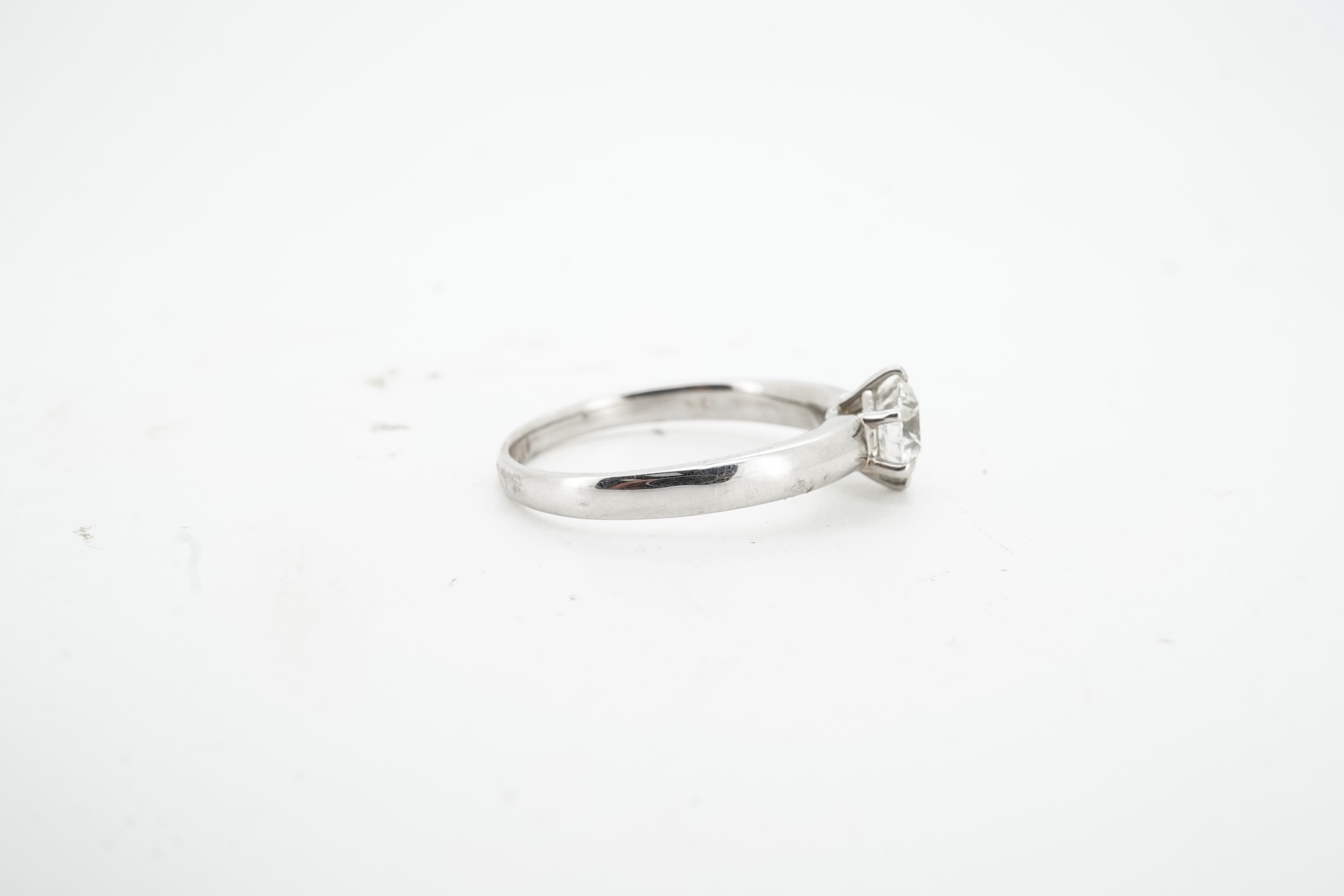 A diamond ring, claw-set with a brilliant-cut diamond weighing approximately 0.80 carats, mounted in white gold, size M, stamped 14K, gross weight approximately 3 grams